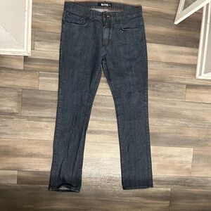 Black denim jeans with orange stitching